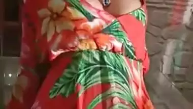 Staggering Desi porn girl in floral dress climbs the glass table