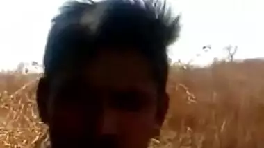 Guy lies on top of Desi girlfriend in front of XXX cameraman outdoors