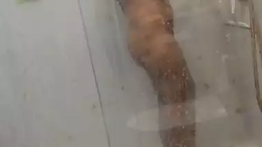Desi girl under shower naked bath caught on camera